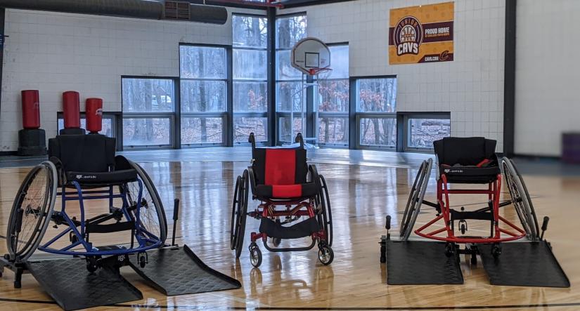 3 wheelchairs on court showing adaptive equipment at the ymca