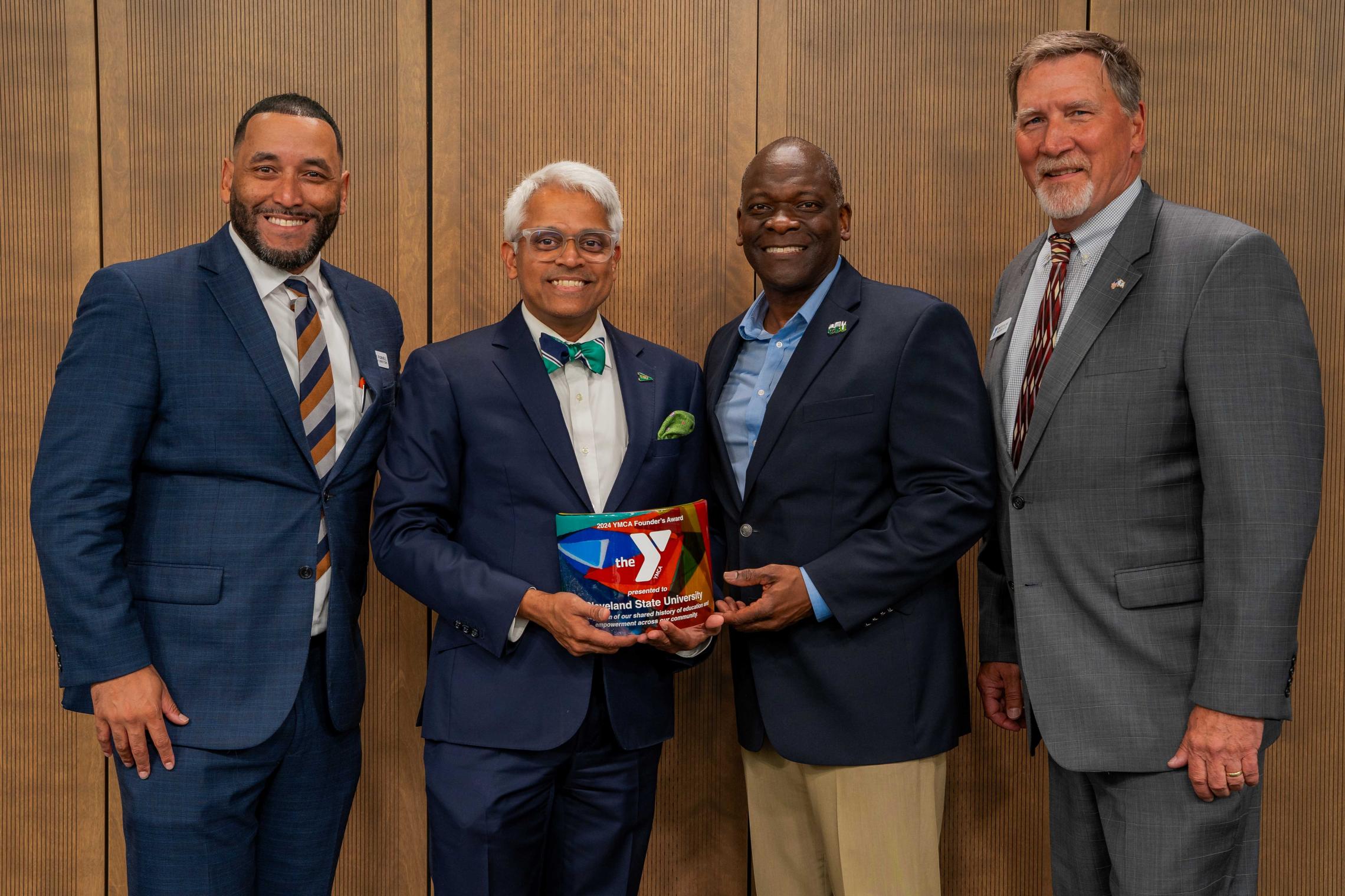 Founder’s Day gift presentation to Dr. Dr. Nigamanth Sridhar with Tim Hilk and LaRese Purnell