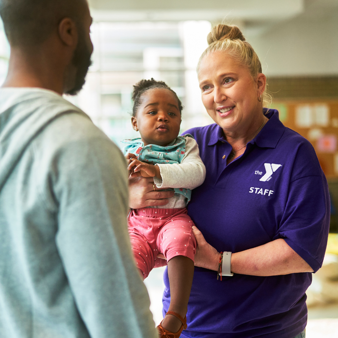 dad dropping off daughter at ymca child watch center