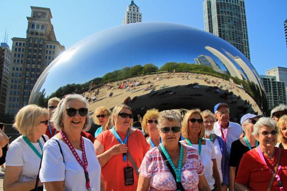 group of aoa members at the bean in chicago