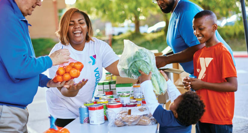 YMCA members volunteering to donate food items