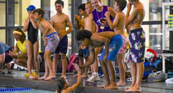 Children learning swim safety