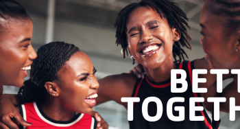 People smiling and embracing after playing basketball