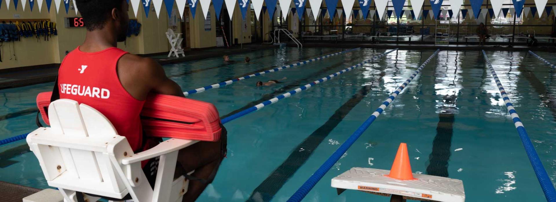 Lifeguard at the French Creek YMCA swimming pool. Image shows lanes for swimming.